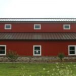Newly built galvanized steel barndominiums in Sahuarita, Arizona showcasing modern architecture and sturdy design